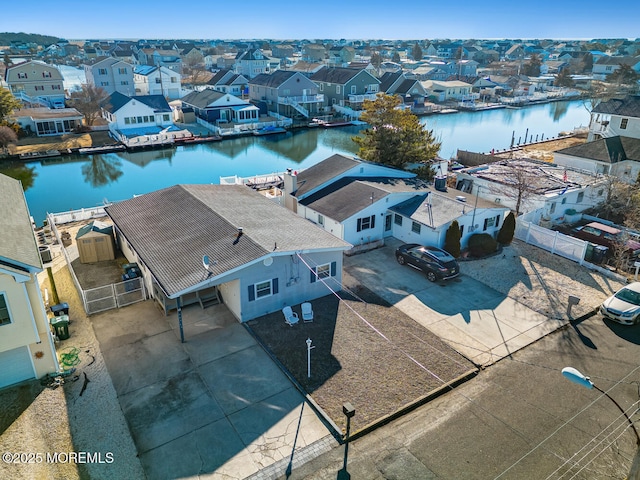 aerial view with a residential view and a water view