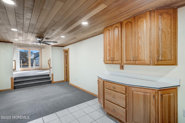 kitchen with light tile patterned flooring, ceiling fan, recessed lighting, wood ceiling, and light colored carpet