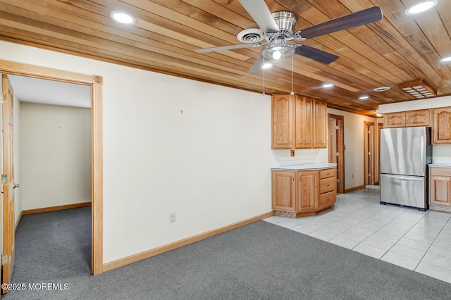 kitchen with freestanding refrigerator, wood ceiling, light carpet, and ceiling fan