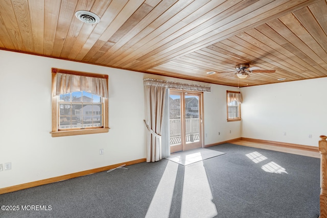 unfurnished room featuring wood ceiling, ornamental molding, baseboards, and ceiling fan