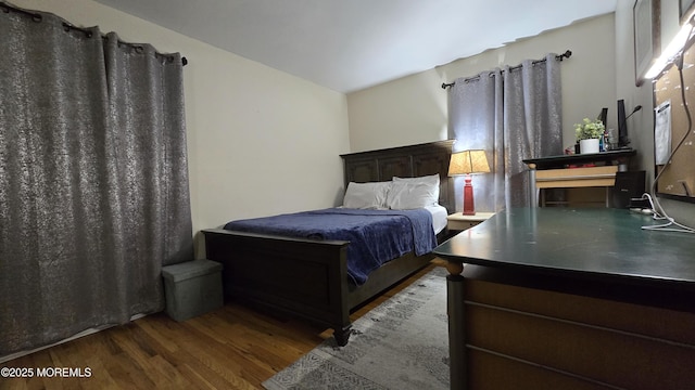 bedroom featuring wood finished floors