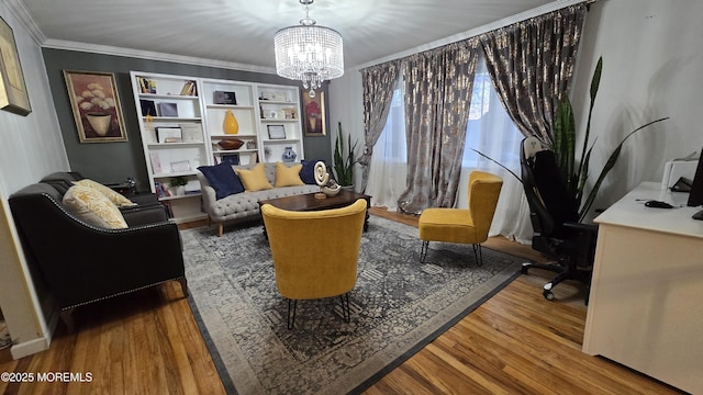 interior space featuring crown molding, an inviting chandelier, and wood finished floors