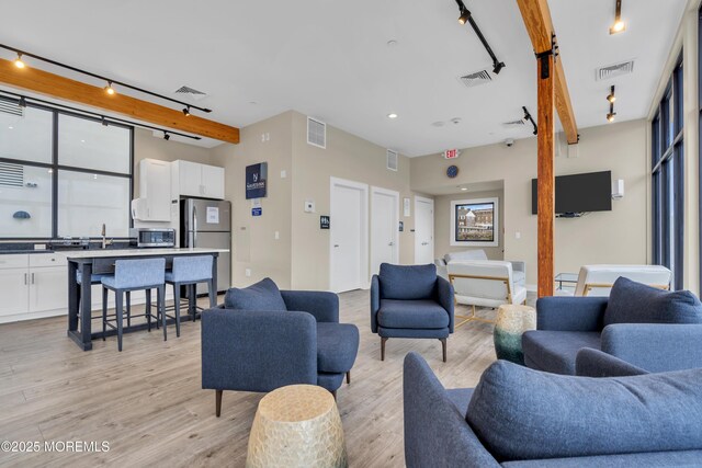 28 Riverside Ave Unit 1H, Red Bank, NJ 07701 - living area with light wood-style floors and visible vents