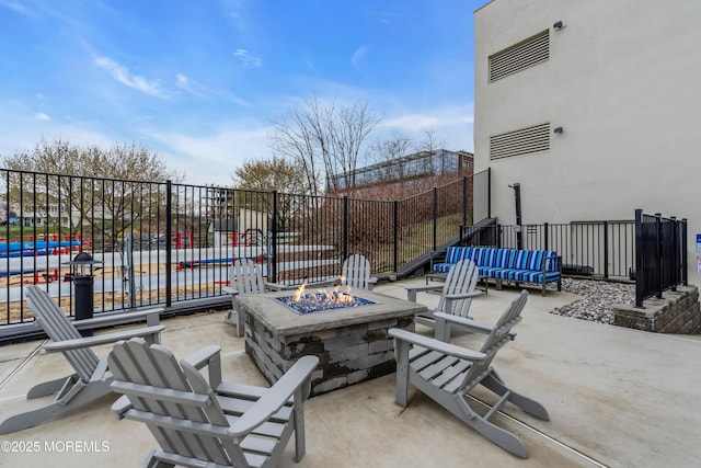 28 Riverside Ave Unit 1H, Red Bank, NJ 07701 - view of patio / terrace with a fire pit and fence