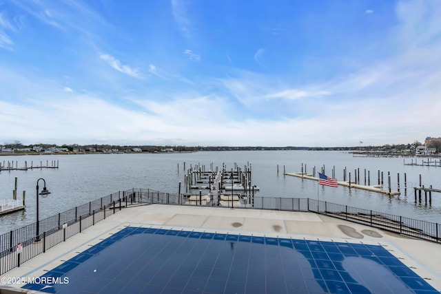 28 Riverside Ave Unit 1H, Red Bank, NJ 07701 - view of swimming pool with a dock, a water view, and fence