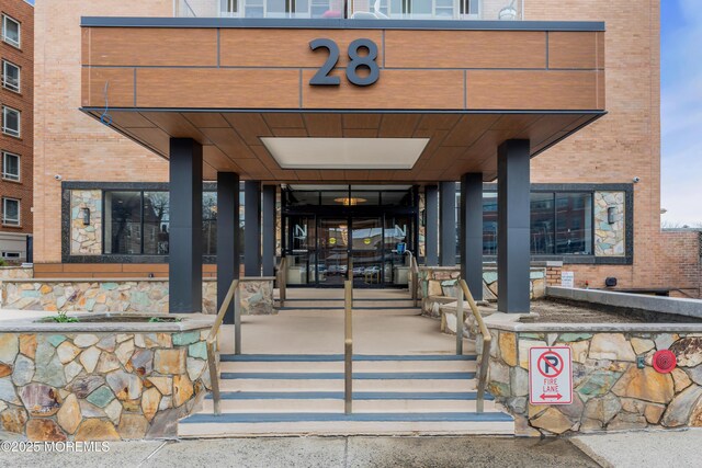 28 Riverside Ave Unit 1H, Red Bank, NJ 07701 - view of exterior entry featuring brick siding