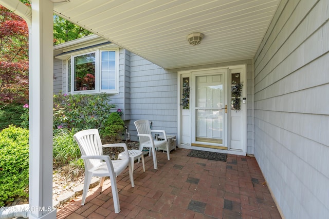 entrance to property with a patio
