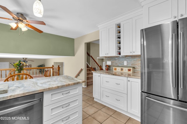 kitchen featuring stainless steel appliances, a ceiling fan, open shelves, decorative backsplash, and light tile patterned flooring