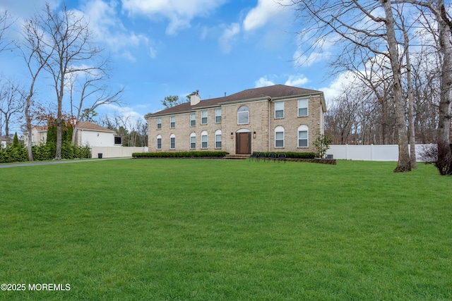view of front of home featuring a chimney
