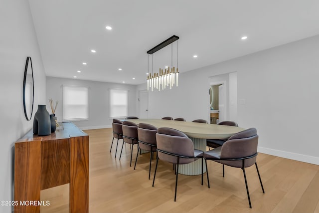 dining space with light wood-style floors, recessed lighting, and baseboards