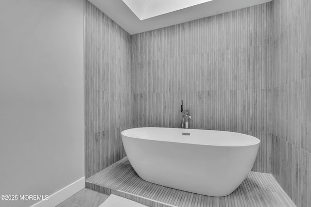 full bath with a freestanding tub