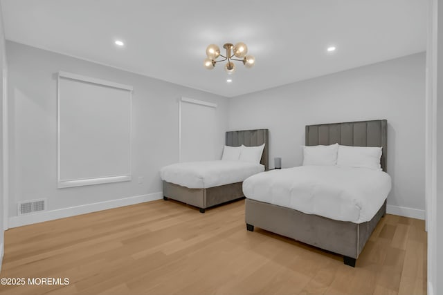 bedroom with light wood-style flooring, baseboards, a chandelier, and recessed lighting