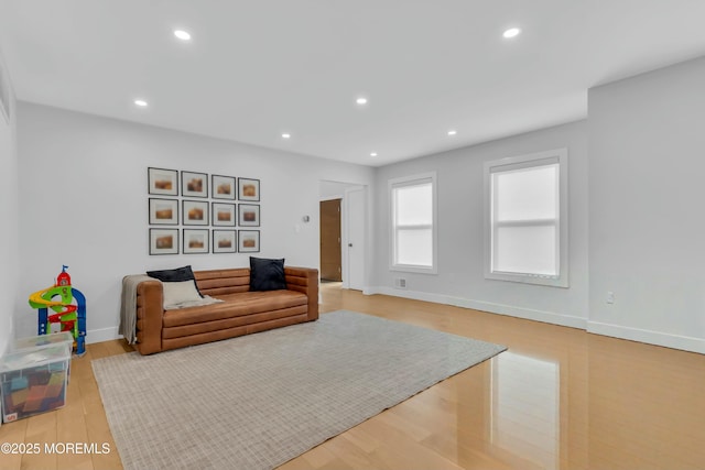 sitting room featuring recessed lighting, baseboards, and wood finished floors