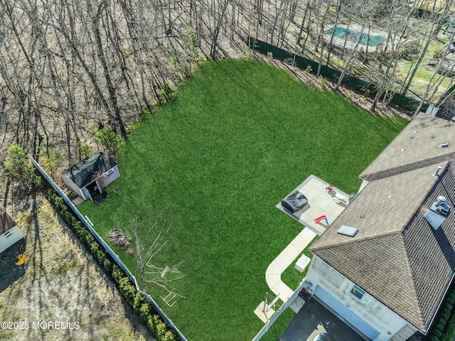 aerial view of property and surrounding area with a pool area