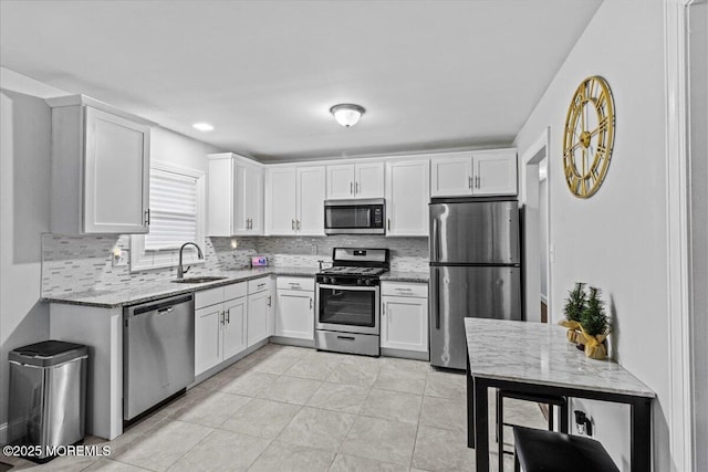 380 Evergreen Dr, Brick, NJ 08723 - kitchen with a sink, tasteful backsplash, appliances with stainless steel finishes, and light stone countertops