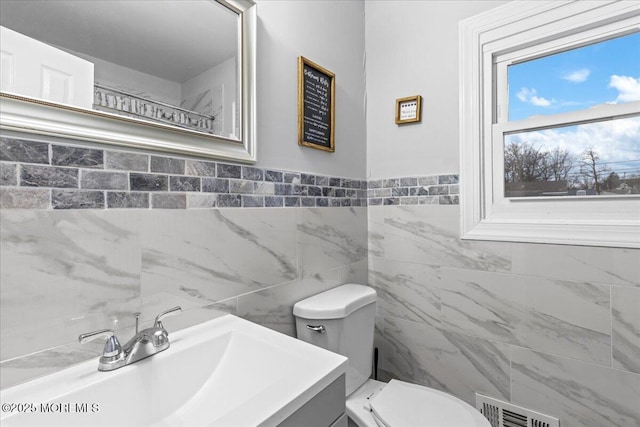 380 Evergreen Dr, Brick, NJ 08723 - bathroom featuring tile walls, visible vents, toilet, and vanity