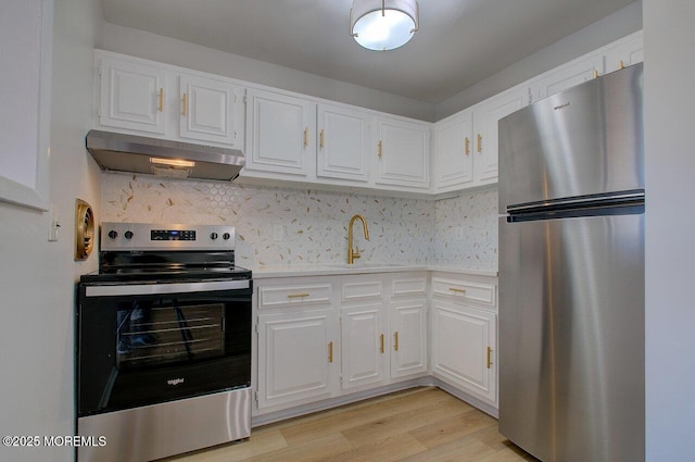 344B Brick Blvd, Brick, NJ 08723 - kitchen featuring light countertops, under cabinet range hood, appliances with stainless steel finishes, and white cabinets