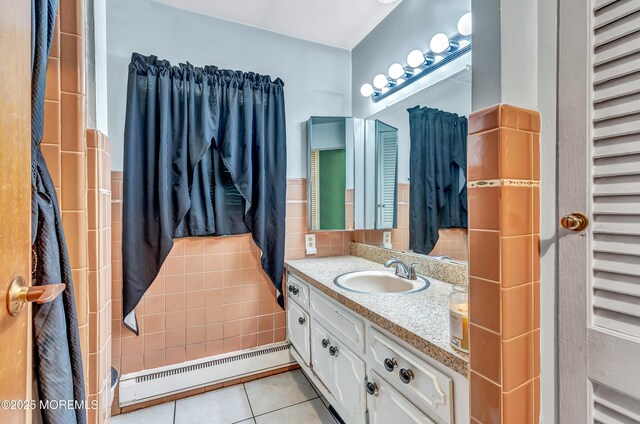 37D Cambridge Ct Unit 100D, Lakewood, NJ 08701 - bathroom featuring a baseboard heating unit, vanity, and tile patterned flooring