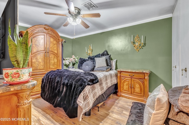 37D Cambridge Ct Unit 100D, Lakewood, NJ 08701 - bedroom with light wood-style floors, crown molding, and ceiling fan