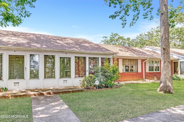 37D Cambridge Ct Unit 100D, Lakewood, NJ 08701 - view of front of house with a front lawn, brick siding, and a shingled roof