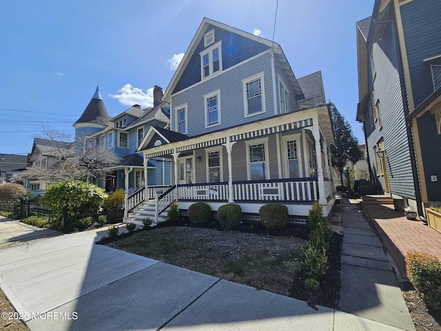 view of front of property featuring covered porch