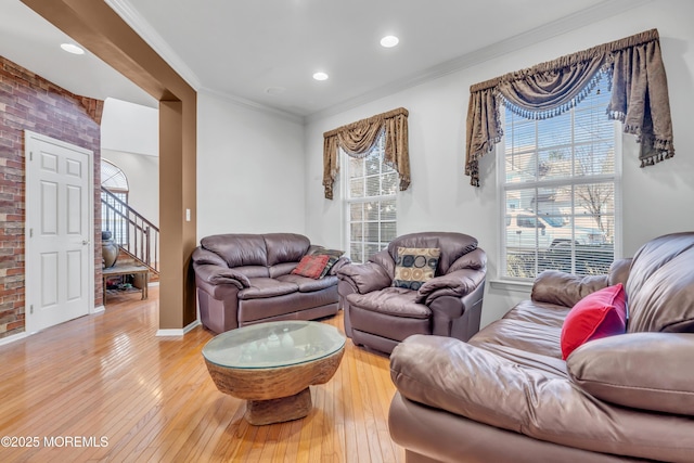 1 Kushnetki Rd, Parlin, NJ 08859 - living room featuring stairs, light wood-type flooring, ornamental molding, and brick wall