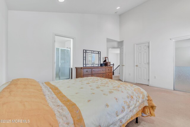 1 Kushnetki Rd, Parlin, NJ 08859 - bedroom with high vaulted ceiling, carpet floors, multiple closets, ensuite bathroom, and baseboards