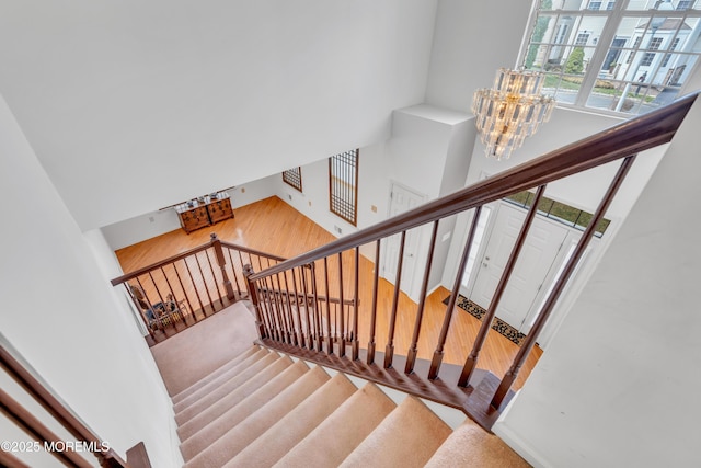 1 Kushnetki Rd, Parlin, NJ 08859 - staircase featuring a notable chandelier
