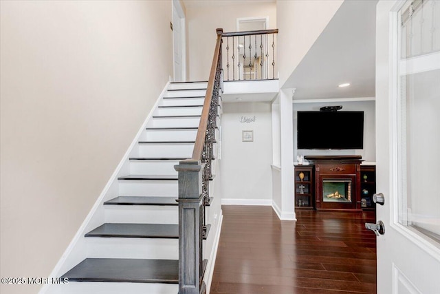 77 Warren Dr, Aberdeen, NJ 07747 - staircase featuring a warm lit fireplace, wood finished floors, baseboards, and recessed lighting