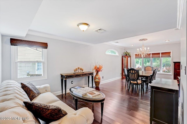 77 Warren Dr, Aberdeen, NJ 07747 - living area featuring a chandelier, wood finished floors, baseboards, and crown molding