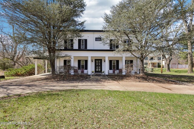 842 Perrineville Rd, Millstone, NJ 08535 - view of front facade featuring a front lawn, concrete driveway, a porch, and a carport