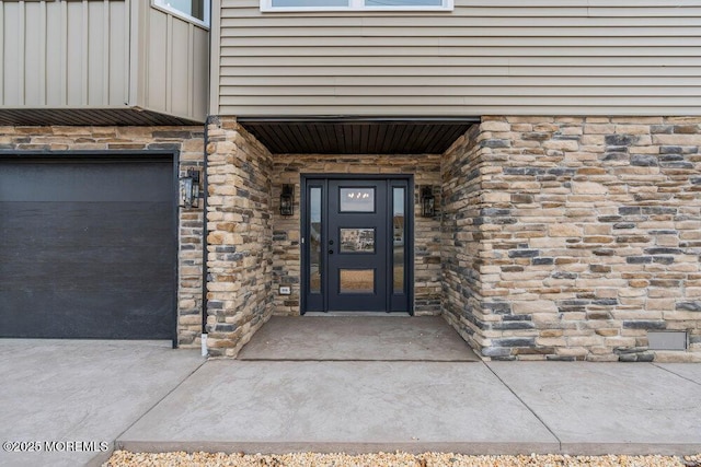 property entrance with stone siding