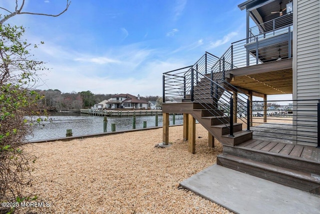 dock area with a water view and stairway