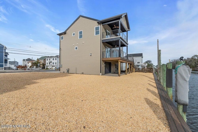 back of property with a balcony