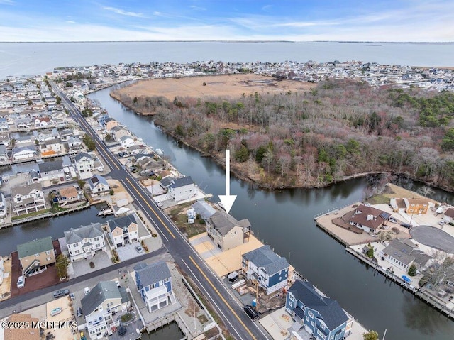 aerial view featuring a residential view and a water view