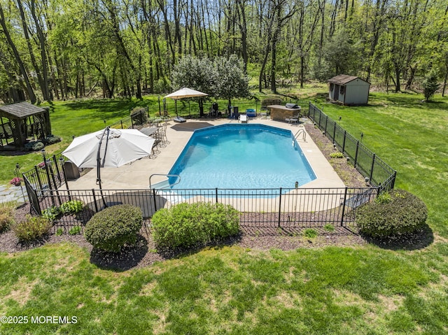 view of pool featuring a gazebo, an outdoor structure, a lawn, and fence