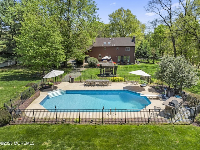 view of swimming pool featuring a gazebo, fence, and a yard