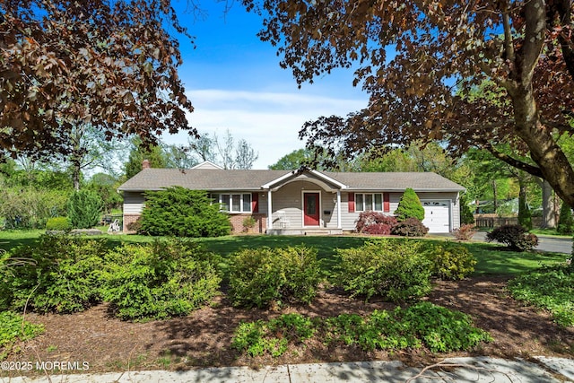 single story home with an attached garage, brick siding, a front yard, and a chimney