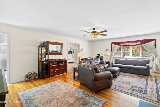 living room with a ceiling fan and wood finished floors