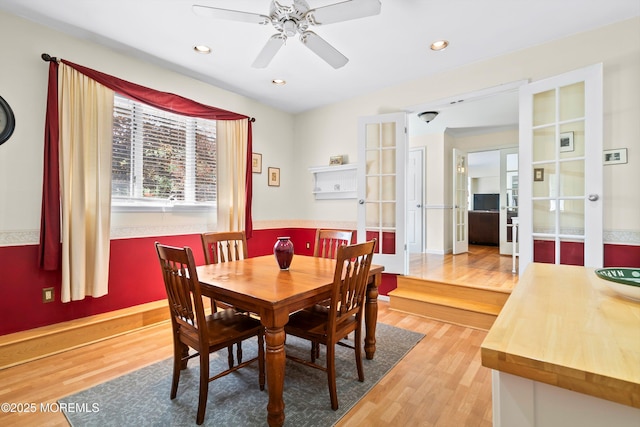 dining area featuring french doors, recessed lighting, and light wood-style flooring