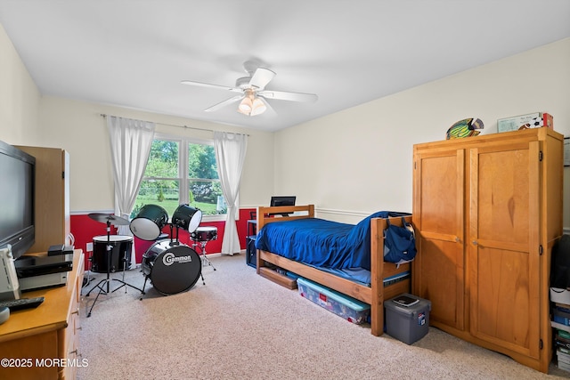 bedroom featuring ceiling fan and light colored carpet