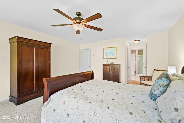 bedroom with baseboards, ceiling fan, and light colored carpet