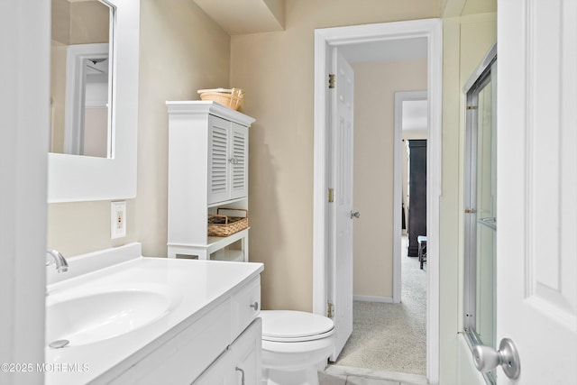 bathroom with toilet and vanity
