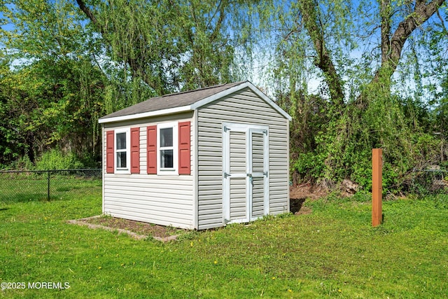view of shed with fence