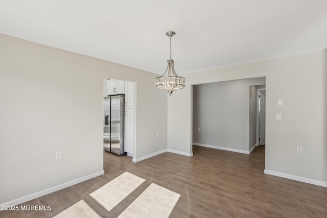 9 Weybridge Pl, Manchester, NJ 08759 - empty room featuring a chandelier, wood finished floors, and baseboards