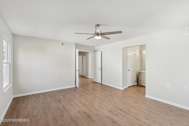 9 Weybridge Pl, Manchester, NJ 08759 - unfurnished bedroom with light wood-style flooring, baseboards, connected bathroom, and ceiling fan