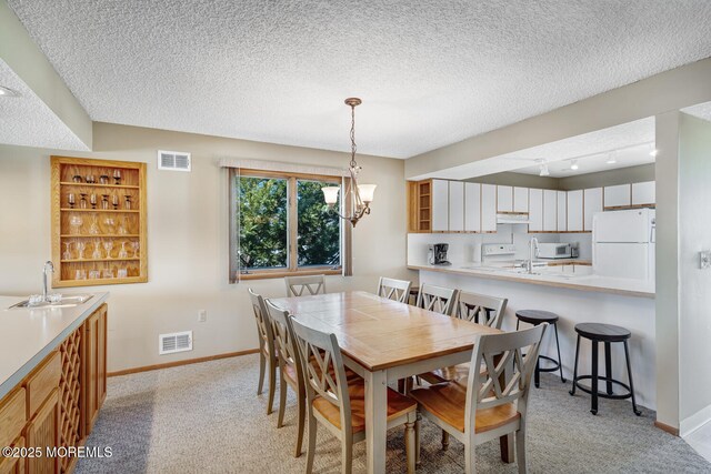 21 Brown Ave Unit 1, Lavallette, NJ 08735 - dining room with visible vents, baseboards, and light colored carpet