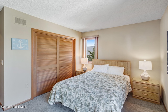 21 Brown Ave Unit 1, Lavallette, NJ 08735 - bedroom with visible vents, a textured ceiling, carpet flooring, and a closet