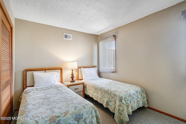 21 Brown Ave Unit 1, Lavallette, NJ 08735 - carpeted bedroom with visible vents, baseboards, and a textured ceiling