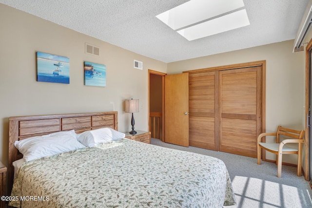 21 Brown Ave Unit 1, Lavallette, NJ 08735 - carpeted bedroom with visible vents, a closet, a textured ceiling, and a skylight